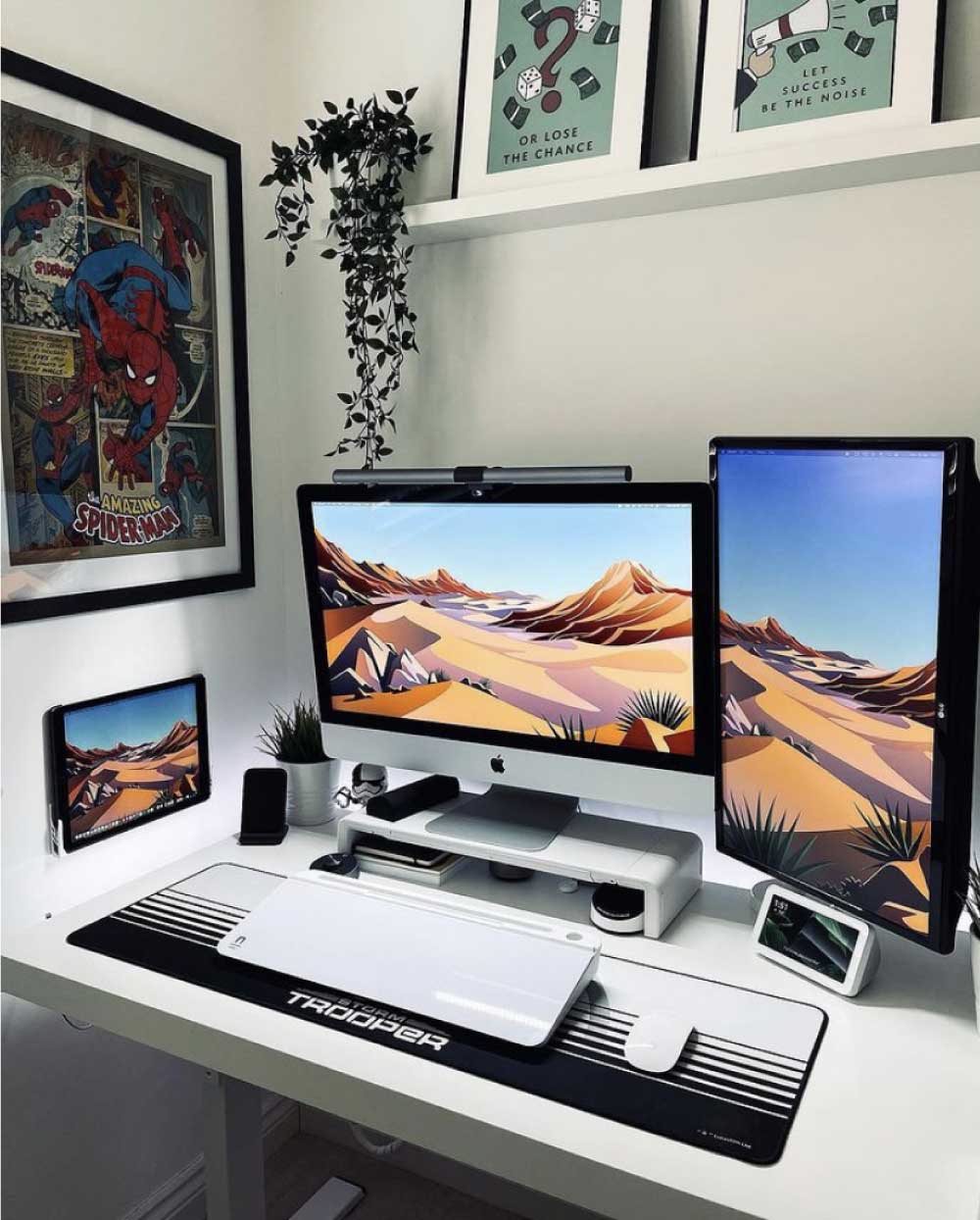Desk setup with a brilliant white notera wedge located underneath a monitor.